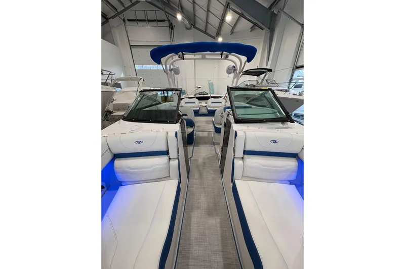  Yacht Photos Pics 2026 Regal LS6 Surf boat interior with blue accents and modern design.