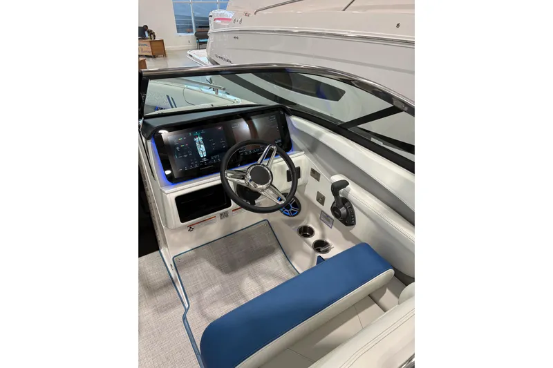  Yacht Photos Pics 2026 Regal LS6 Surf boat interior with modern dashboard and steering wheel.