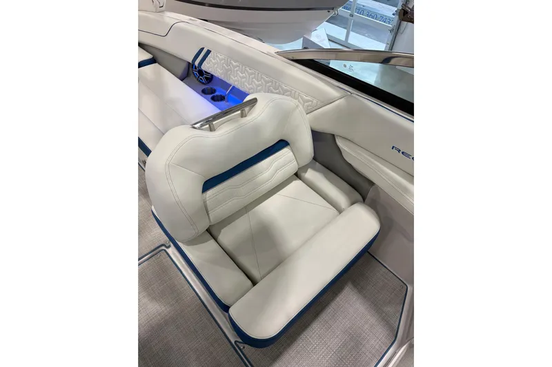  Yacht Photos Pics 2026 Regal LS6 Surf boat interior with luxurious white and blue seating.