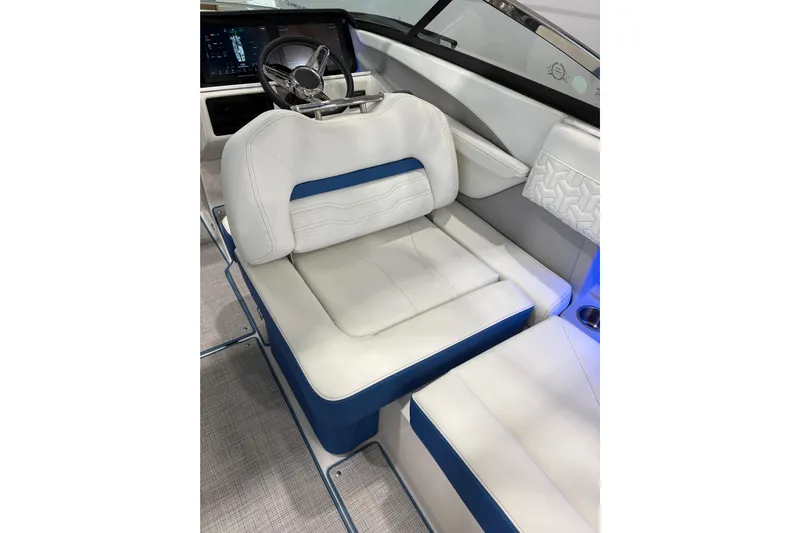  Yacht Photos Pics 2026 Regal LS6 Surf boat interior with white and blue seating, modern dashboard.