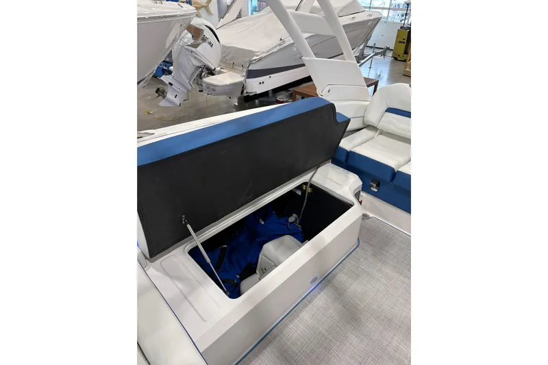  Yacht Photos Pics 2026 Regal LS6 Surf boat interior with open storage compartment.