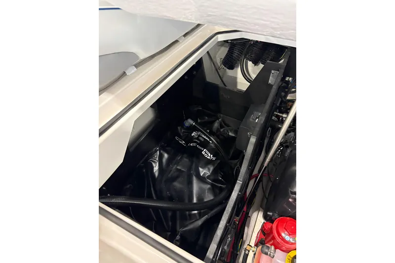  Yacht Photos Pics 2026 Regal LS6 Surf boat engine compartment with visible components and wiring.