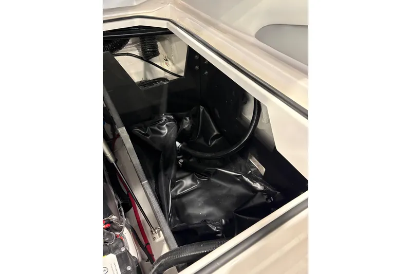  Yacht Photos Pics Engine compartment of 2026 Regal LS6 Surf boat, showcasing internal components and wiring.