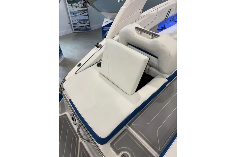  Yacht Photos Pics 2026 Regal LS6 Surf boat interior with white seating and blue accents.