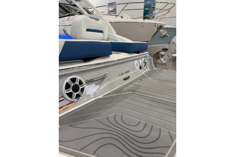  Yacht Photos Pics 2026 Regal LS6 Surf boat with sleek design and modern features in showroom.