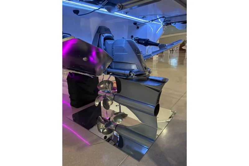  Yacht Photos Pics 2026 Regal LS6 Surf boat propeller and drive system with vibrant lighting.