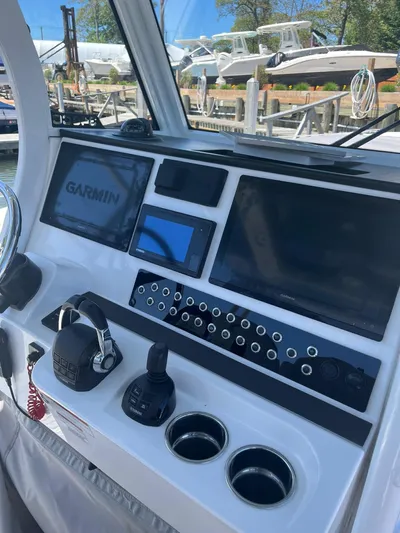  Yacht Photos Pics Edgewater 340CC 2021 boat dashboard with Garmin navigation system and controls.