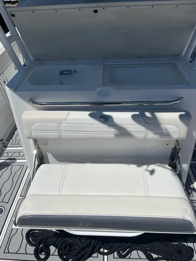  Yacht Photos Pics 2021 Edgewater 340CC boat interior with white seating and sink area.