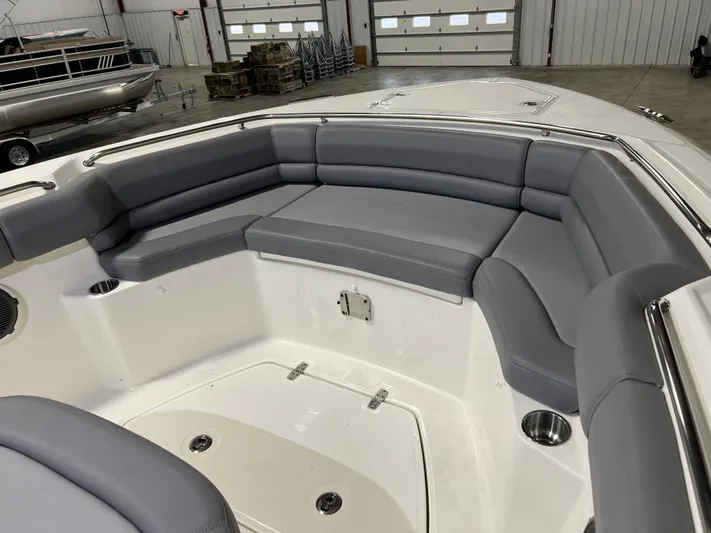  Yacht Photos Pics 2022 Boston Whaler 330 Outrage boat interior with gray cushioned seating.