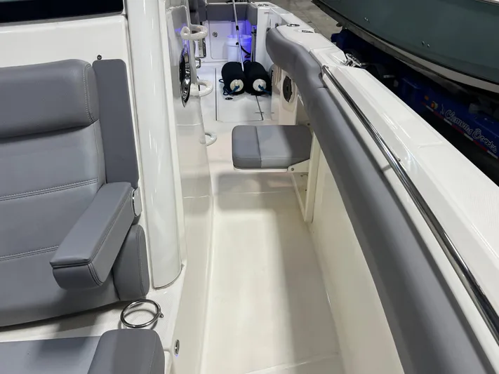  Yacht Photos Pics 2022 Boston Whaler 330 Outrage interior with gray seating and modern design.