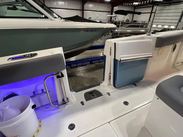  Yacht Photos Pics Interior view of 2022 Boston Whaler 330 Outrage boat in a showroom.