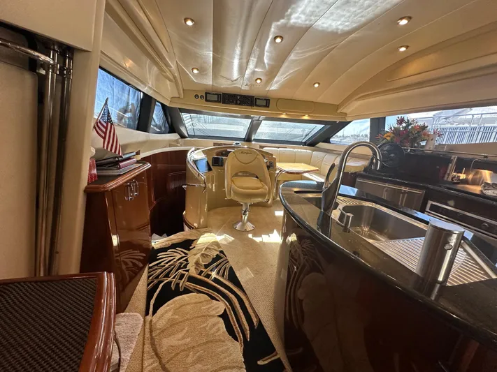 La Vida Loca Yacht Photos Pics Luxurious interior of a 2004 Marquis 59 yacht with elegant furnishings and modern amenities.