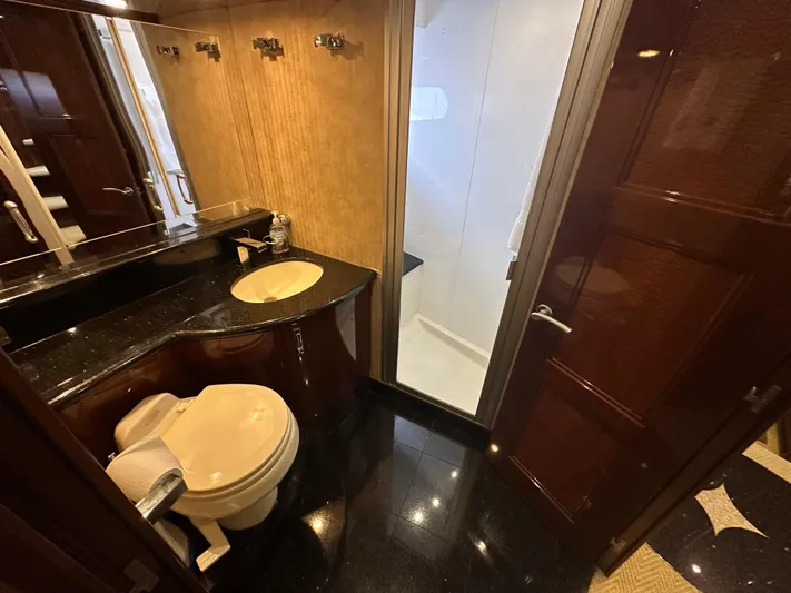 La Vida Loca Yacht Photos Pics Luxurious 2004 Marquis 59 yacht bathroom with modern fixtures and elegant design.