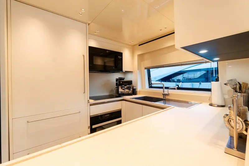 Vasiliki Yacht Photos Pics Modern kitchen interior on 2019 Sanlorenzo SX76 yacht, featuring sleek appliances and ample counter space.