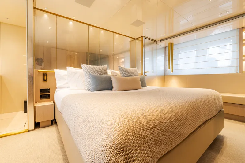 Vasiliki Yacht Photos Pics Luxurious bedroom interior of 2019 Sanlorenzo SX76 yacht with elegant decor and plush bedding.