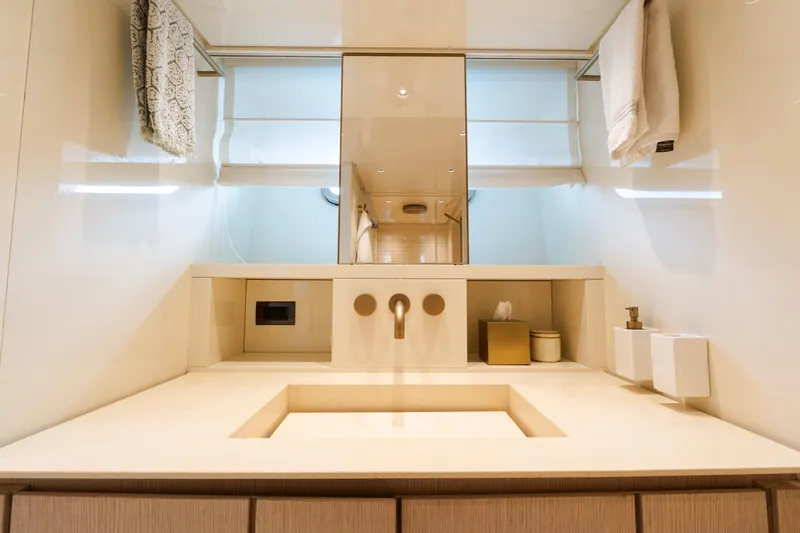 Vasiliki Yacht Photos Pics Luxurious bathroom interior of 2019 Sanlorenzo SX76 yacht, featuring modern sink and elegant fixtures.