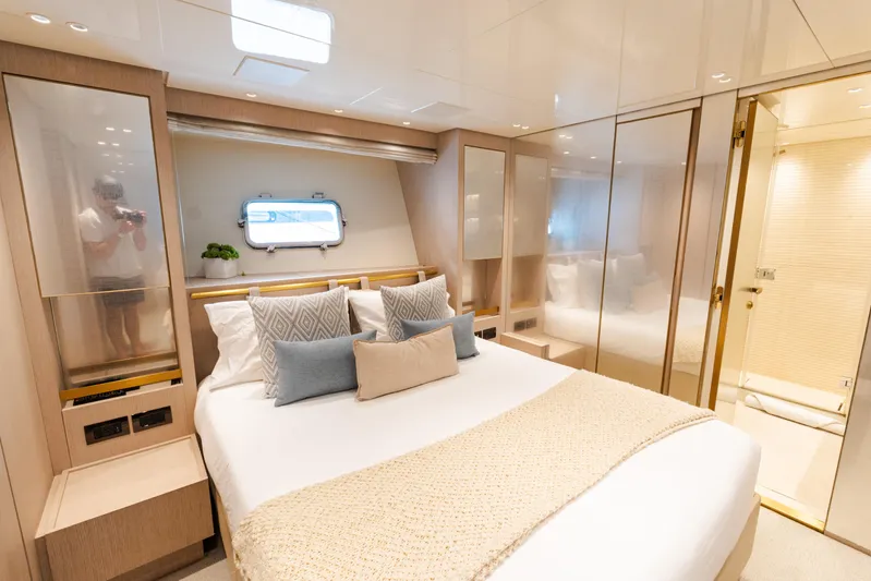 Vasiliki Yacht Photos Pics Luxurious 2019 Sanlorenzo SX76 yacht bedroom with elegant decor and modern amenities.