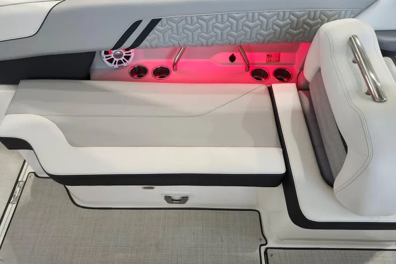  Yacht Photos Pics Luxurious 2025 Regal LX6 boat interior with ambient red lighting and sleek seating design.