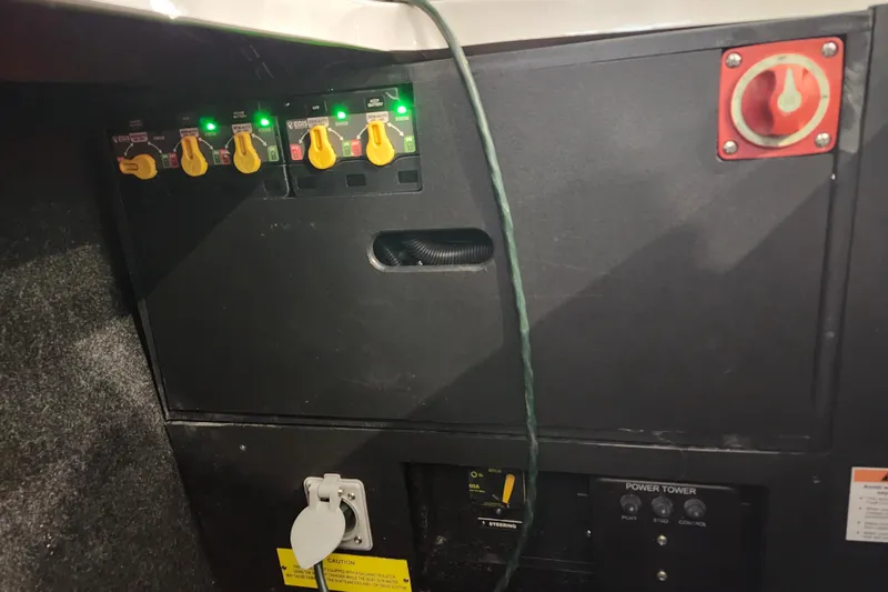  Yacht Photos Pics Control panel of a 2025 Regal LX6 boat with switches and power outlets.