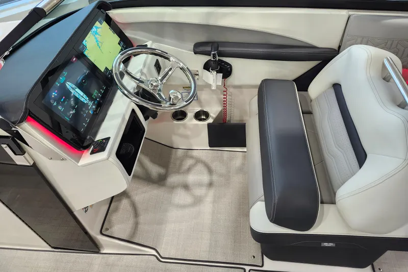  Yacht Photos Pics 2025 Regal LX6 boat cockpit with modern steering and digital display.