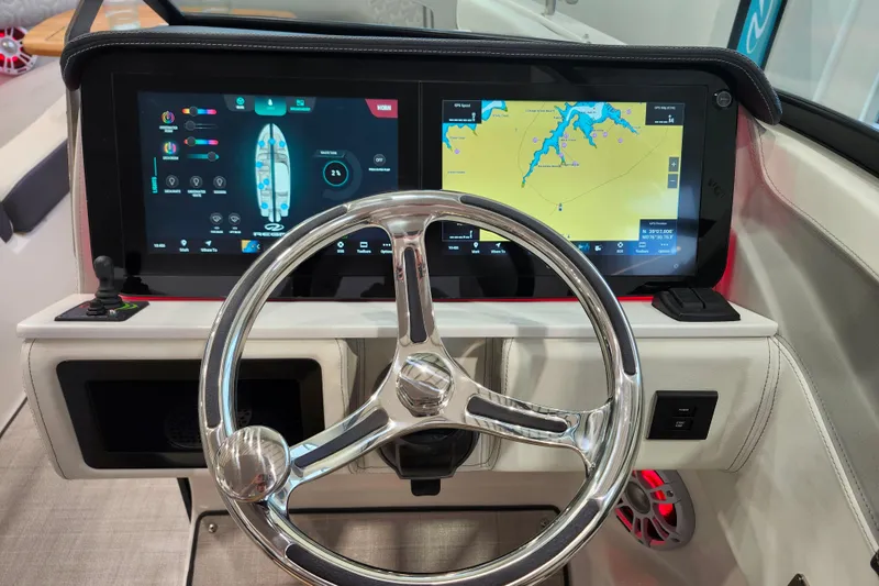  Yacht Photos Pics 2025 Regal LX6 boat dashboard with dual touchscreens and modern steering wheel.