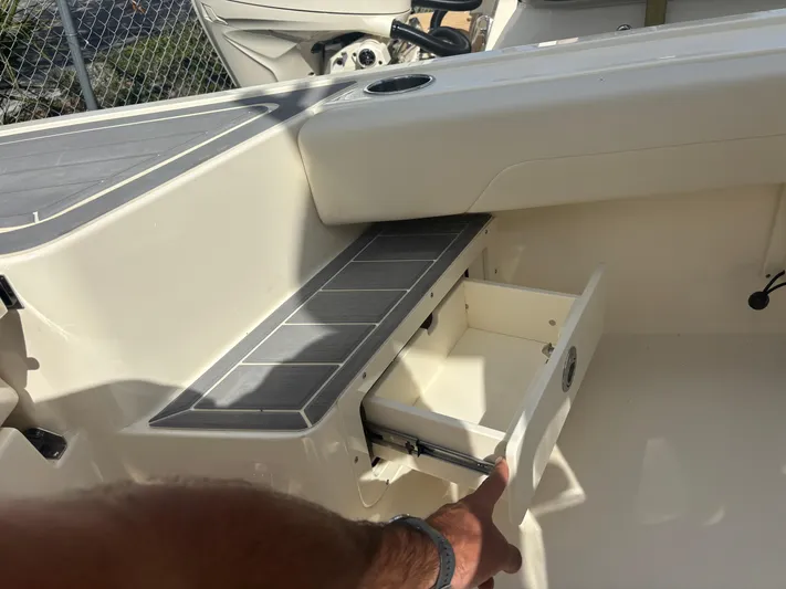  Yacht Photos Pics 2025 Scout 281 XSS boat interior with open storage compartment.