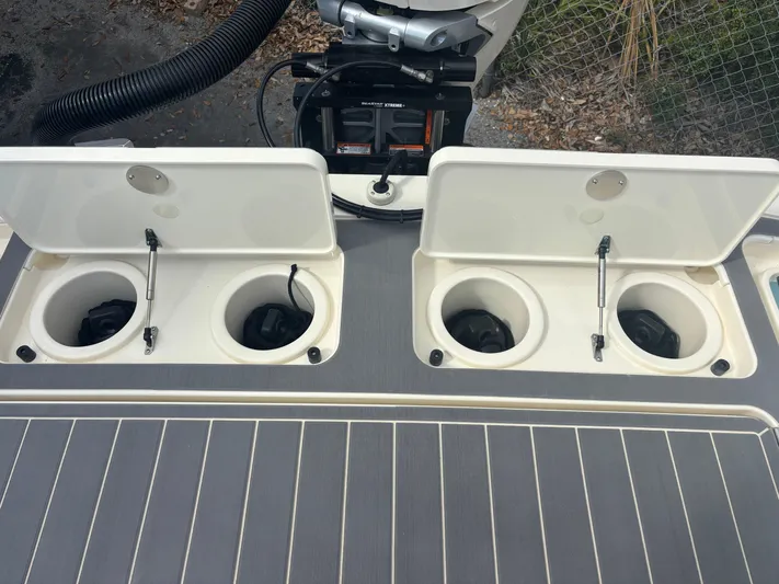  Yacht Photos Pics 2025 Scout 281 XSS boat with open storage compartments on deck.