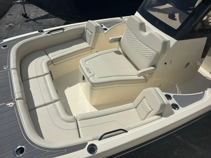 Yacht Photos Pics 2025 Scout 281 XSS boat interior with luxurious seating and modern design.