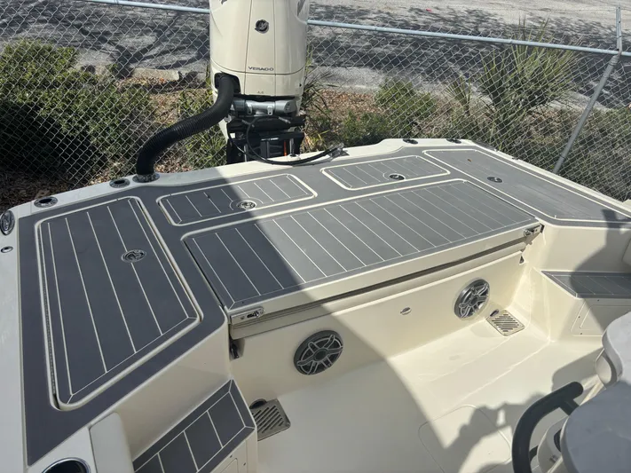  Yacht Photos Pics 2025 Scout 281 XSS boat deck with motor, featuring sleek design and modern amenities.