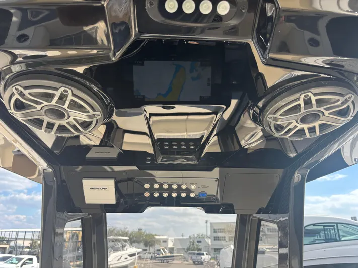  Yacht Photos Pics 2025 Scout 281 XSS boat interior with advanced audio system and navigation display.