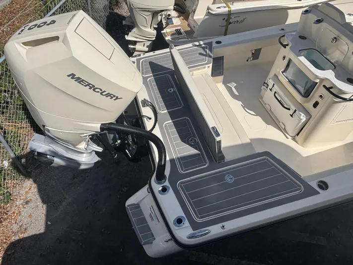  Yacht Photos Pics 2025 Scout 281 XSS boat with Mercury engine, featuring spacious deck and modern design.
