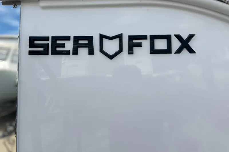  Yacht Photos Pics Sea Fox 368 Commander 2026 logo on white surface, showcasing sleek design.