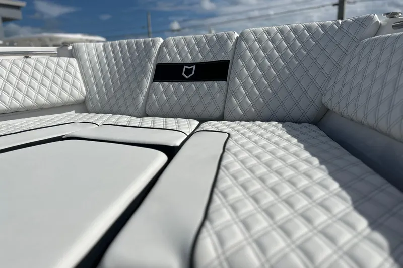  Yacht Photos Pics Luxurious seating on 2026 Sea Fox 368 Commander boat with quilted white upholstery.