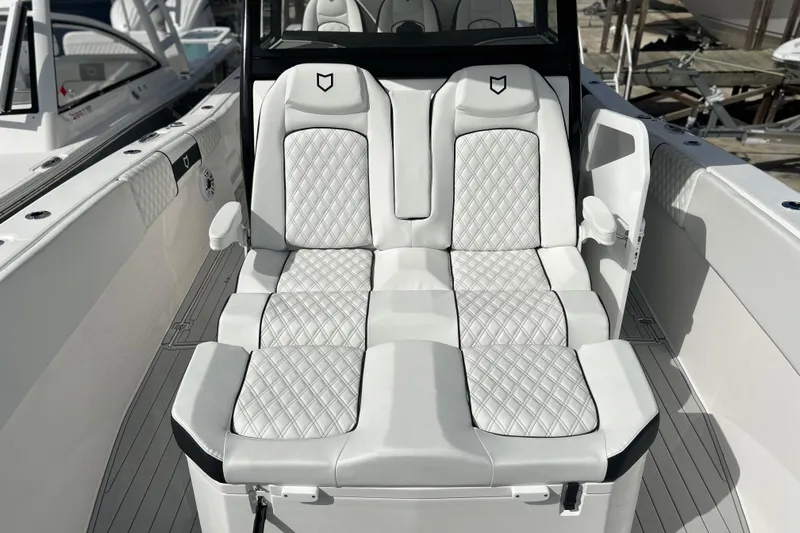  Yacht Photos Pics Luxurious seating on 2026 Sea Fox 368 Commander boat, featuring elegant white upholstery.