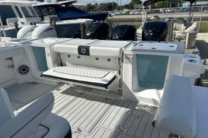 Yacht Photos Pics 2026 Sea Fox 368 Commander boat interior with seating and outboard motors.