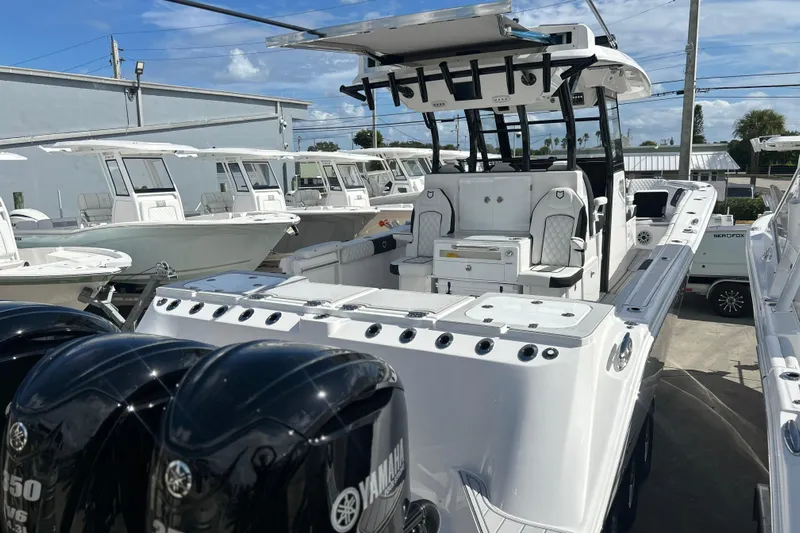  Yacht Photos Pics 2026 Sea Fox 368 Commander boat with Yamaha engines, docked under a clear blue sky.