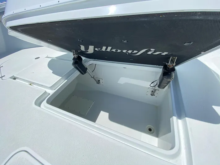  Yacht Photos Pics 2019 Yellowfin 39 boat storage compartment with open lid.