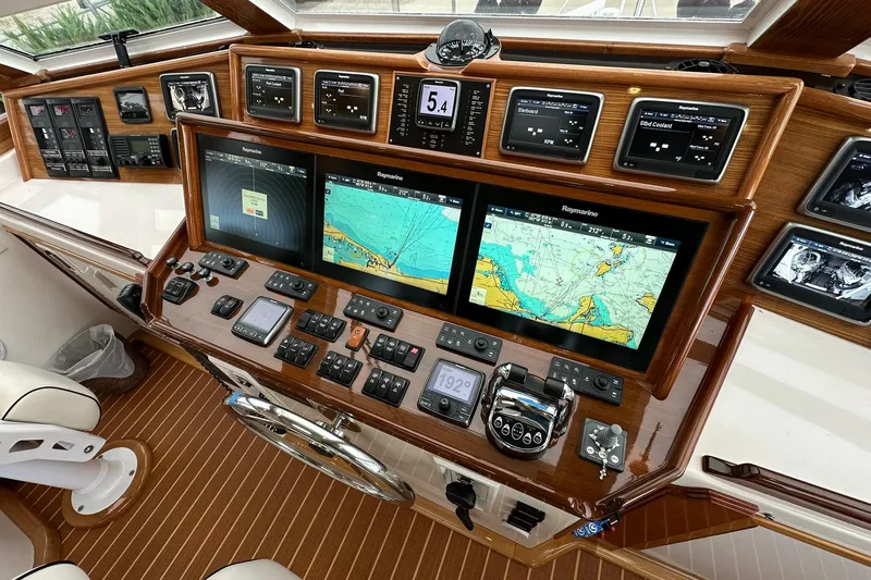 So Blessed Yacht Photos Pics Helm of 1998 Viking 54 Motor Yacht with navigation screens and controls.