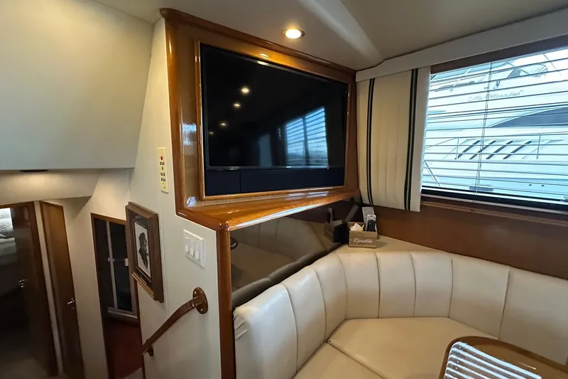 So Blessed Yacht Photos Pics Interior of 1998 Viking 54 Motor Yacht with TV and seating area.