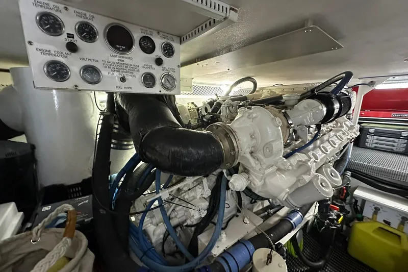 So Blessed Yacht Photos Pics Engine room of a 1998 Viking 54 Motor Yacht, showcasing detailed machinery and control panel.