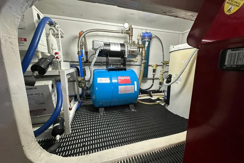 So Blessed Yacht Photos Pics Engine room of 1998 Viking 54 Motor Yacht with Dayton equipment and plumbing.