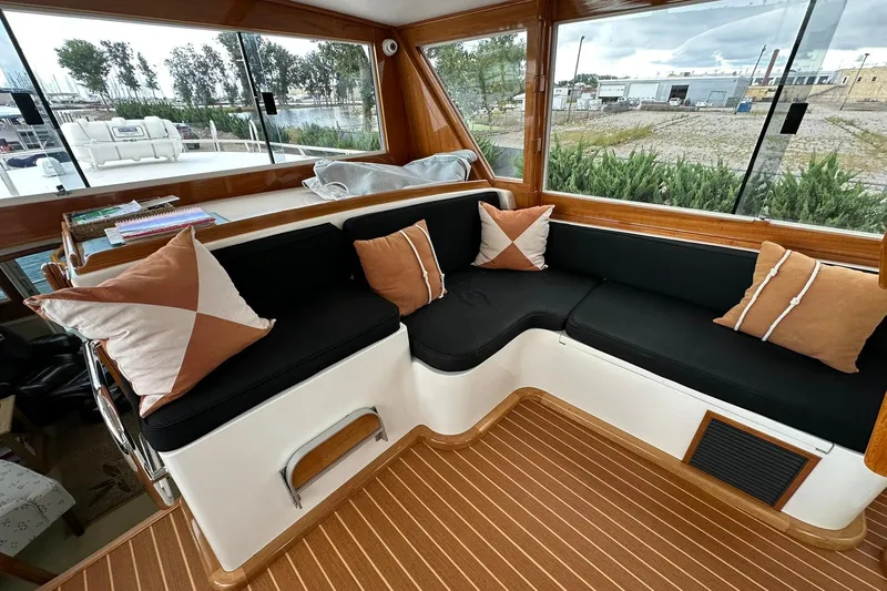 So Blessed Yacht Photos Pics Interior of 1998 Viking 54 Motor Yacht with cozy seating and decorative pillows.