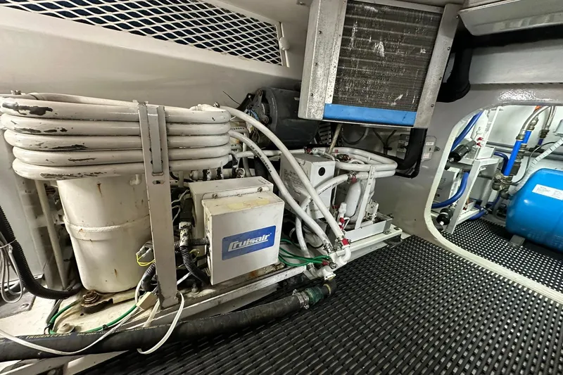 So Blessed Yacht Photos Pics Engine room of 1998 Viking 54 Motor Yacht with Cruisair system and coiled pipes.