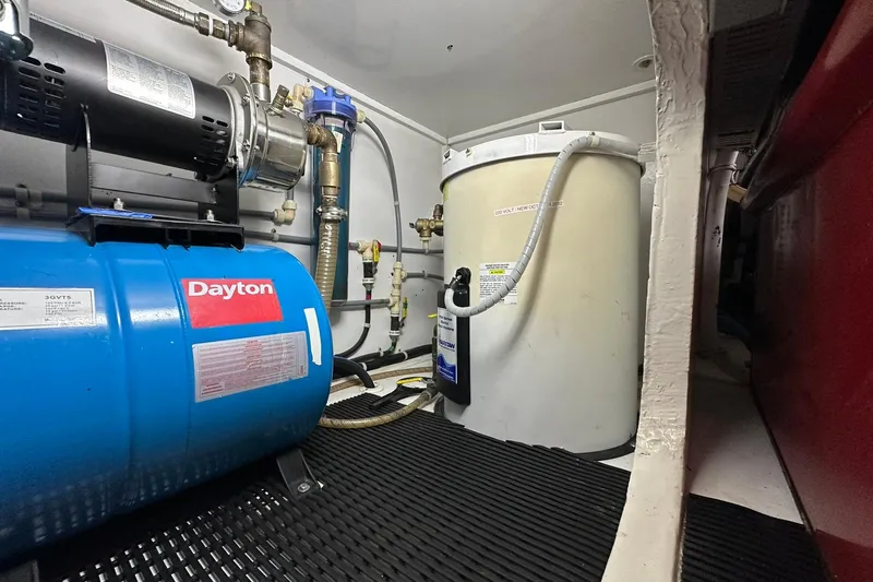 So Blessed Yacht Photos Pics Engine room of 1998 Viking 54 Motor Yacht with Dayton equipment and water tank.