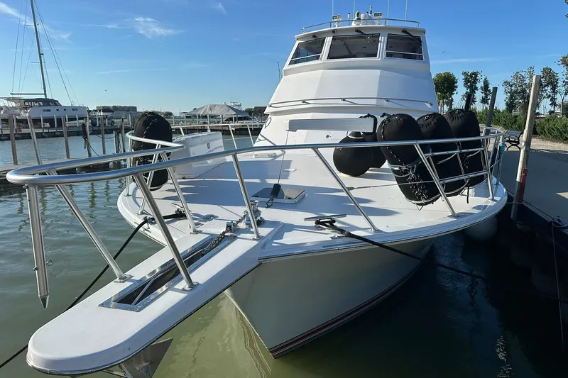 So Blessed Yacht Photos Pics 1998 Viking 54 Motor Yacht docked, featuring sleek design and sturdy railings.