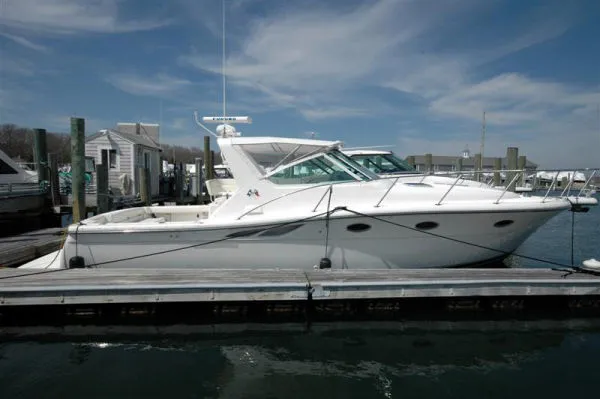 Vixen Yacht Photos Pics 2002 Tiara Yachts 3500 Open docked under sunny skies.