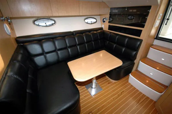 Vixen Yacht Photos Pics 2002 Tiara Yachts 3500 Open interior with black leather seating.