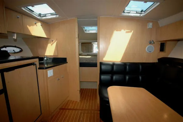 Vixen Yacht Photos Pics Interior of 2002 Tiara Yachts 3500 Open with wooden furnishings.