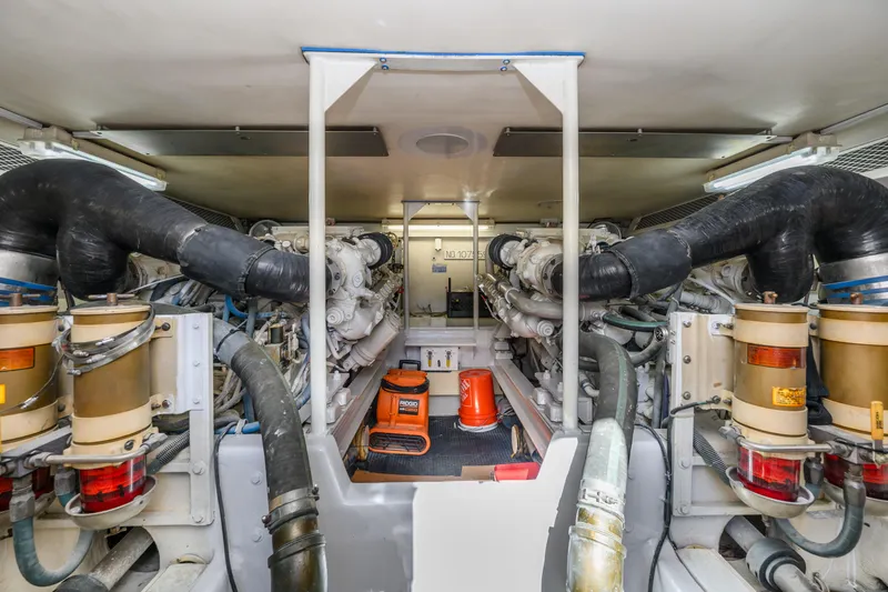 Marysea Yacht Photos Pics Engine room of 1999 Viking 58 Convertible yacht, showcasing dual engines and equipment.
