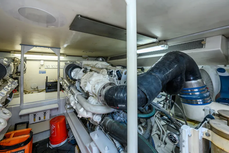 Marysea Yacht Photos Pics Engine room of a 1999 Viking 58 Convertible yacht, showcasing complex machinery and equipment.